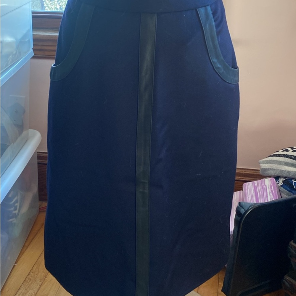 Beautiful dark blue midi skirt withi skirt with black leather. NWOT